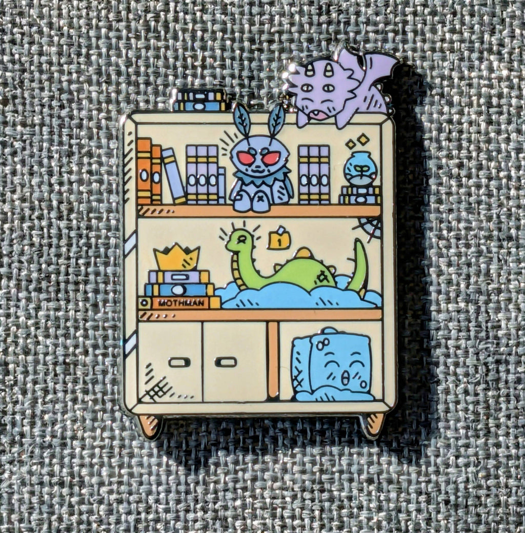 Mimic Gaming Co - Cryptid Bookshelf Enamel Pin - 1.5"